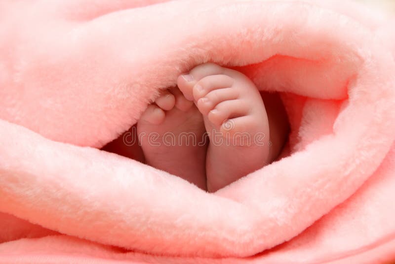 Baby feet nestled towel