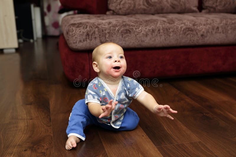 Baby on the floor stock photo. Image of house, flooring 61991382