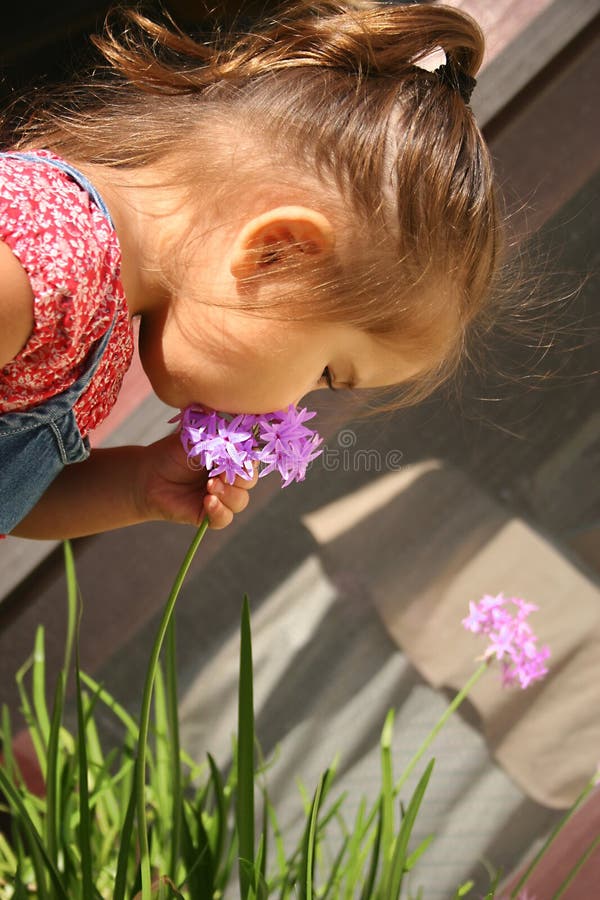 Baby with flowers stock image. Image of gardener, adorable 309881