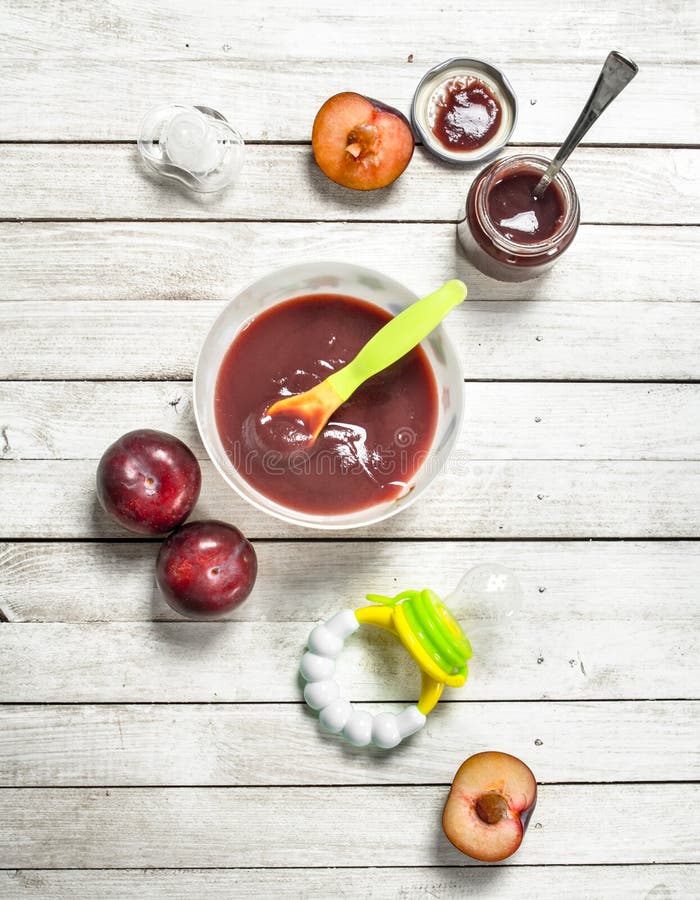 Baby food. Baby puree from fresh plum. royalty free stock photography Baby food. Baby puree from fresh plum. royalty free stock photography