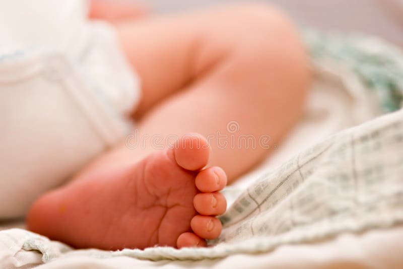Close up of baby foot. Shallow depth of field. Dought stock images, royalty-free photos and pictures