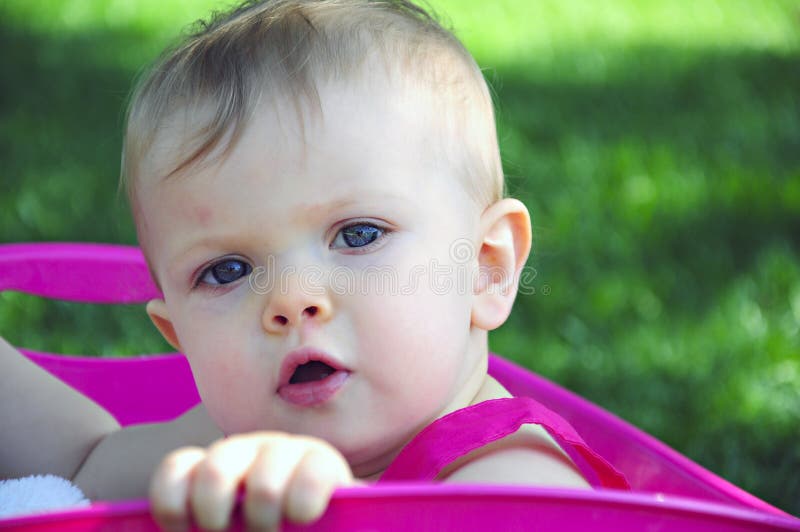 Baby Gazing up in Pink Tub royalty free stock photos