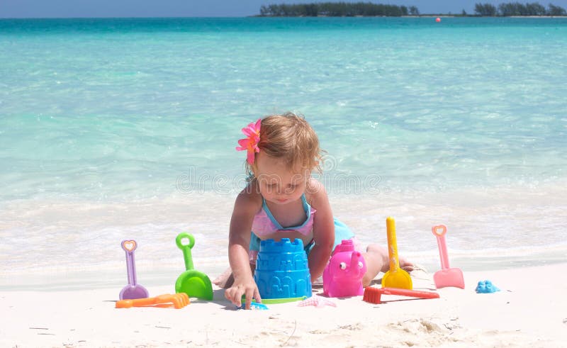 A baby girl on the beach royalty free stock images