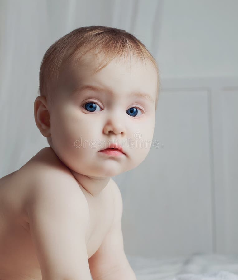 Baby girl in bed stock photo. Image of parenting, child 77199498