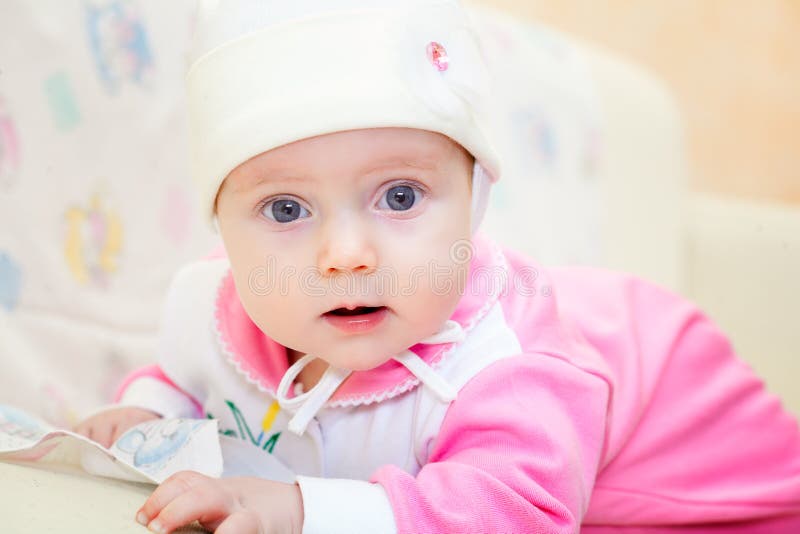 Baby girl in on the bed stock image. Image of person 35429341
