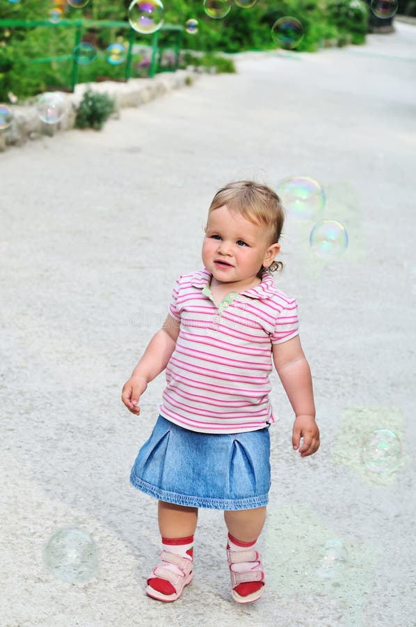 Baby girl and bubbles stock image. Image of dream, circle 15188365