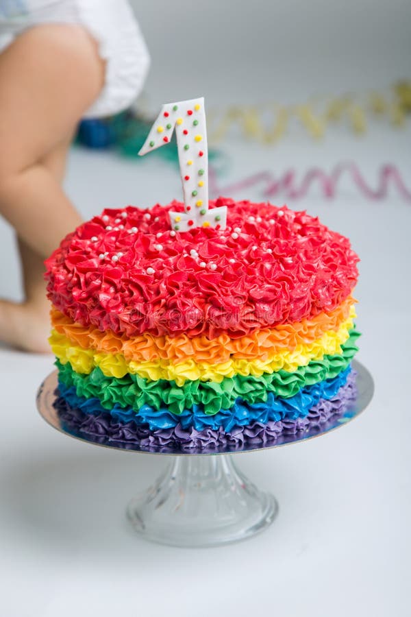 Baby girl celebrating her first bithday with gourmet cake.