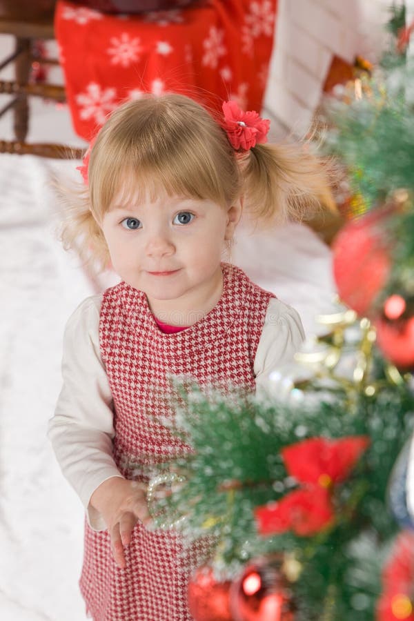 Baby Girl beside Christmas Tree Stock Image - Image of classic, lovely ...