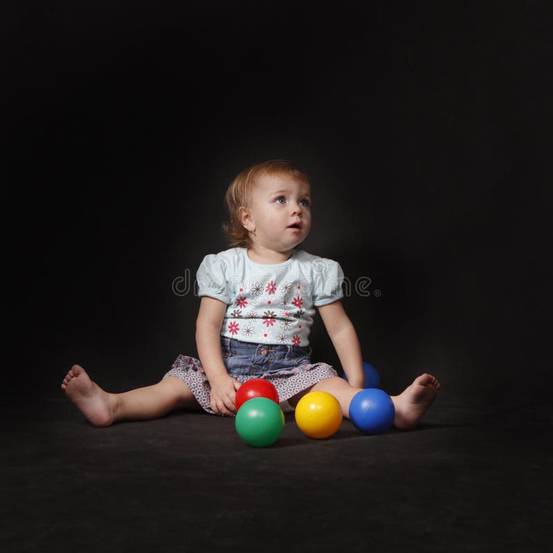 Baby girl with color balls royalty free stock photos Baby girl with color balls royalty free stock photos