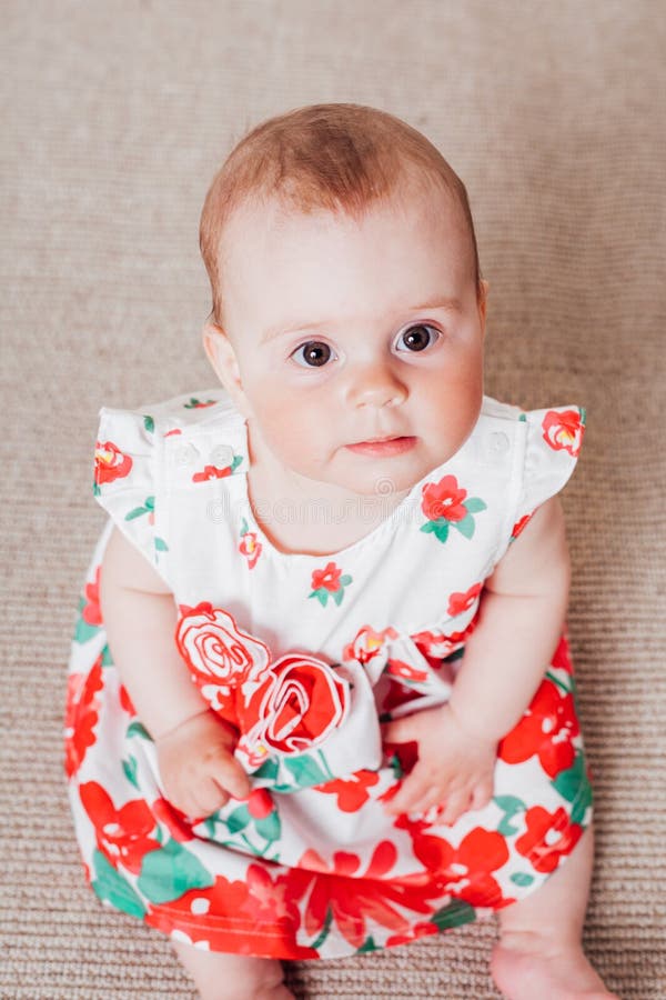 Baby Girl in a Dress with Red Flowers Stock Image - Image of happy ...