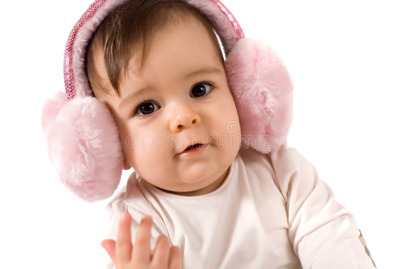 Adorable baby girl with ear warmer, studio shot. Lovely european female stock images, royalty-free photos and pictures