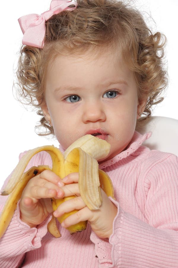 Baby girl eating fruit stock image. Image of food, happiness 28235253
