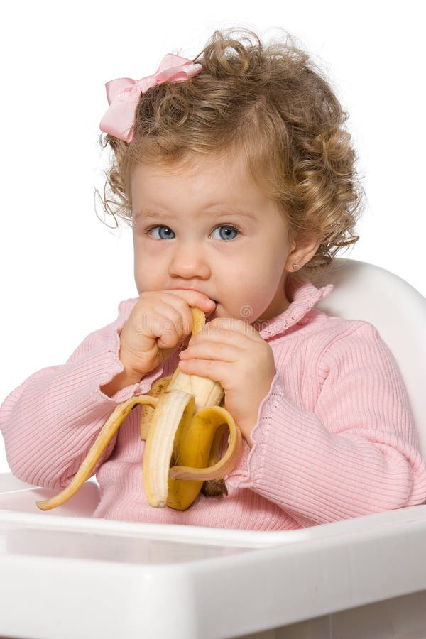 Baby girl eating fruit stock image. Image of food, happiness 28235253