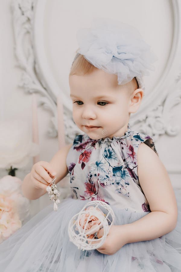 Baby Girl Elegant Dress. a One-year-old Girl in a Puffy Dress and a ...