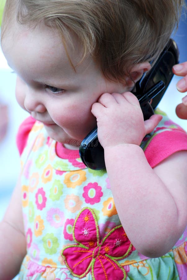 Baby Girl Holding A Cell Phone