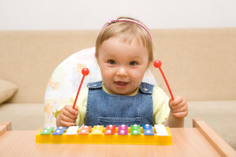 Baby girl with instrument