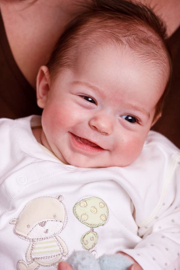 Baby girl laughing with toothless smile