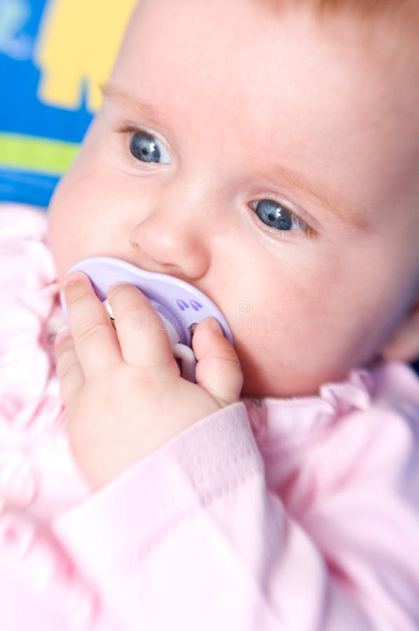 Baby girl with pacifier stock photo. Image of holds, portrait 15531068