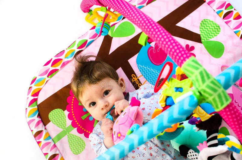 Baby Girl Playing in an Activity Gym Stock Photo Image of small