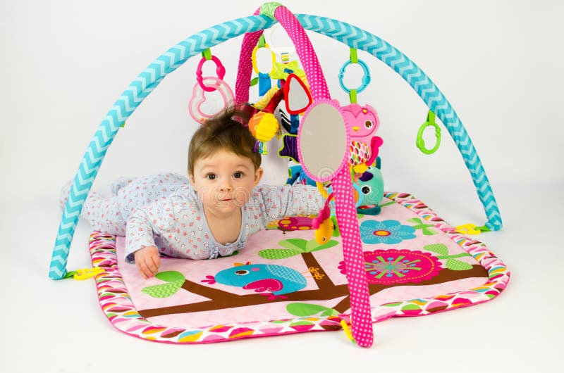 Baby Girl Playing in an Activity Gym Stock Photo Image of play