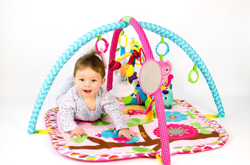 Baby Girl Playing in an Activity Gym Stock Photo Image of colorful