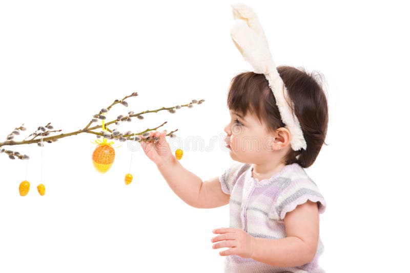 Baby girl playing with easter eggs