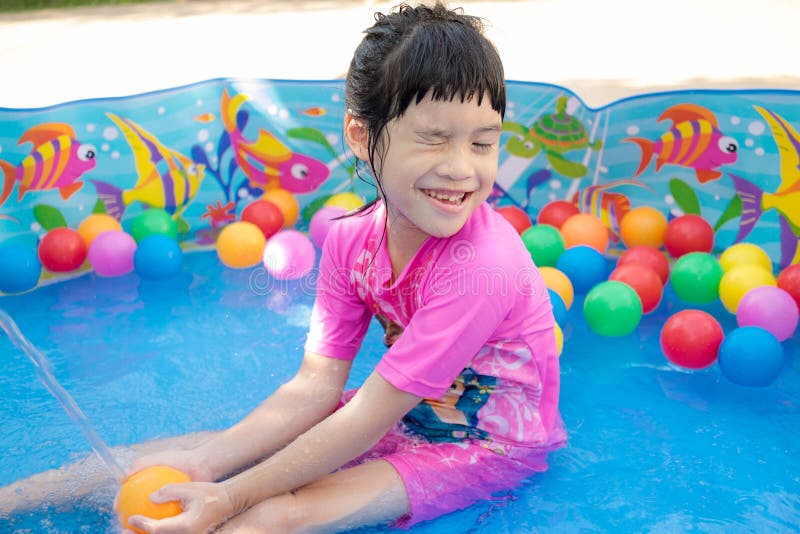 Baby Girl Playing in Kiddie Pool Stock Photo - Image of people, little: 55110626
