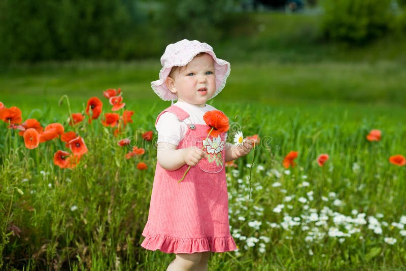 Baby-girl with red flower