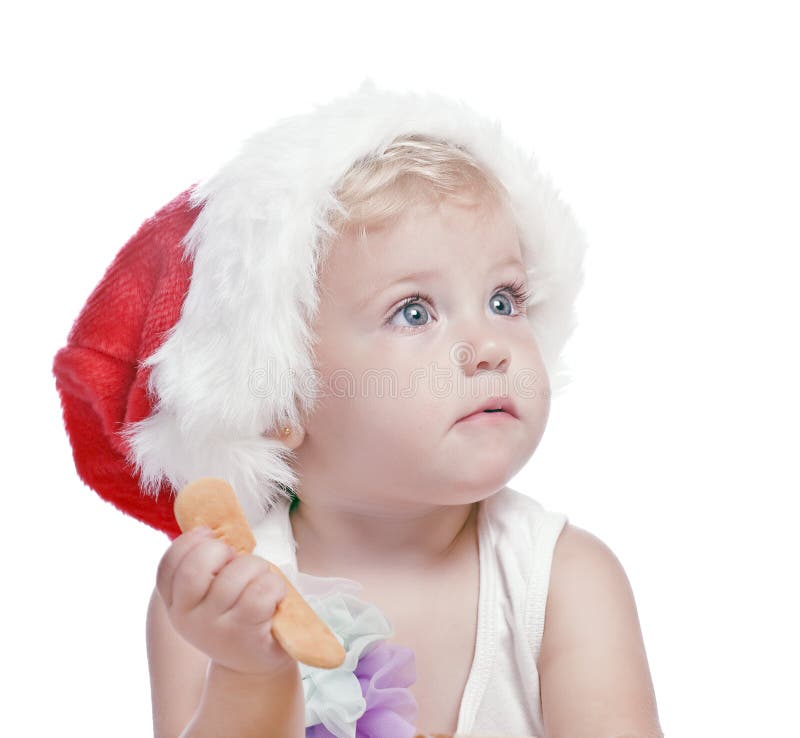 Baby girl in a red new year cap