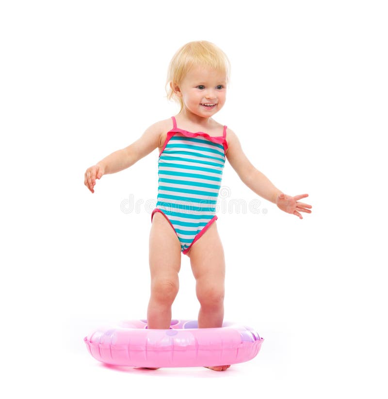 https://thumbs.dreamstime.com/b/baby-girl-swimsuit-standing-inflatable-ring-25702582.jpg