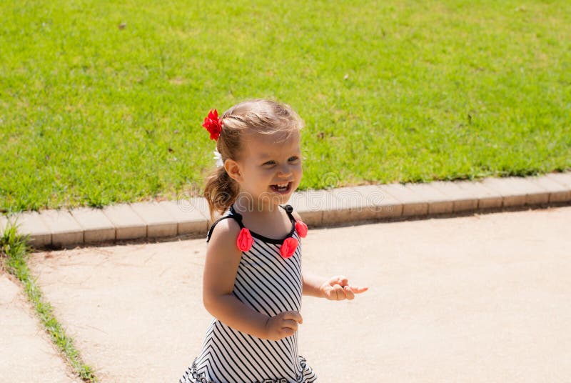 The Baby Girl Walking Alone in Park Stock Image Image of little