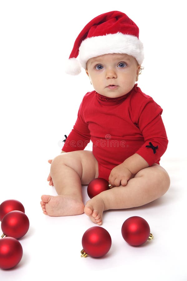 Baby Girl Wearing a Santa Claus Hat, Playing with Red Balls Stock Photo ...
