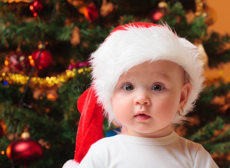 Baby girl wearing santa hat