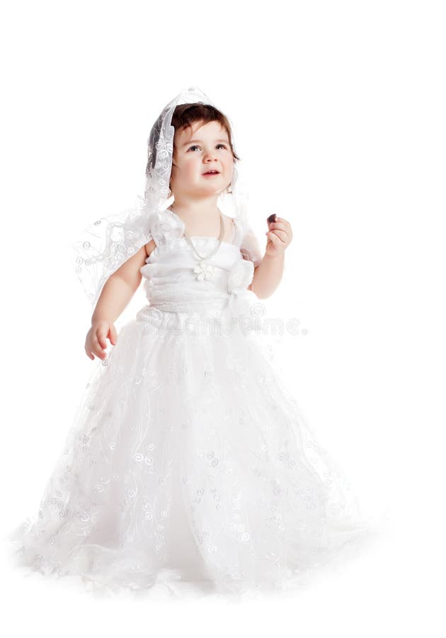 Baby girl in a white wedding dress