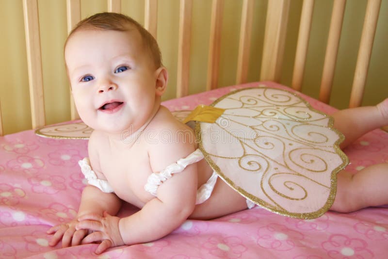 Baby Girl with Wings stock image. Image of happy, blanket 1401153