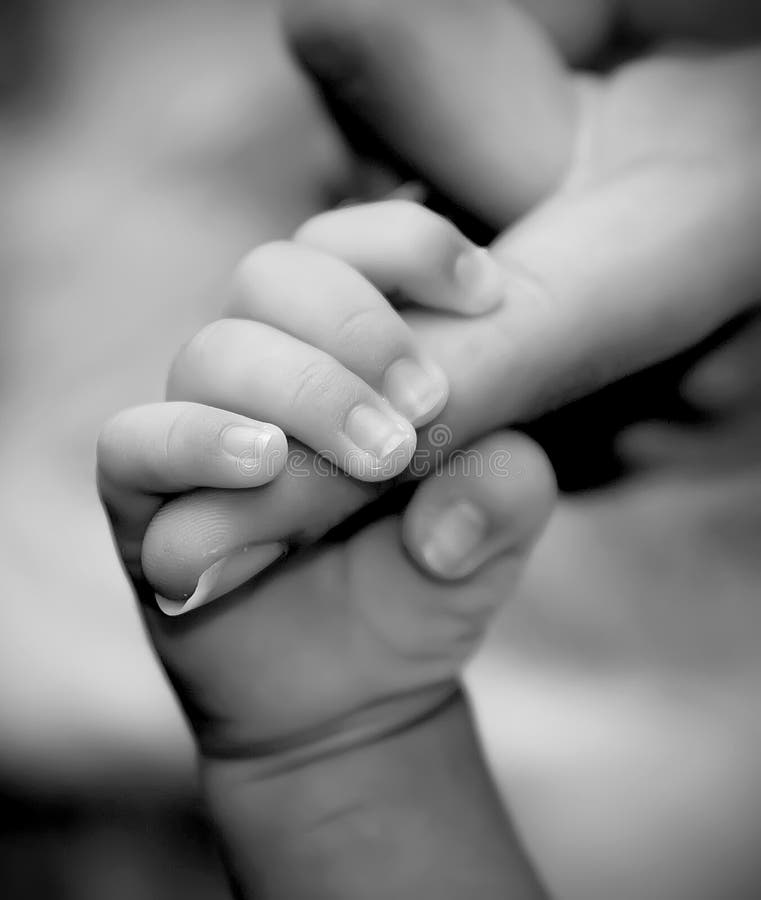 Baby hand holding mother s finger