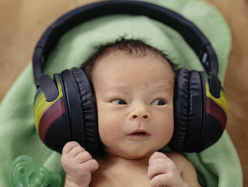 Baby with Headphones stock image. Image of amazement 31865995