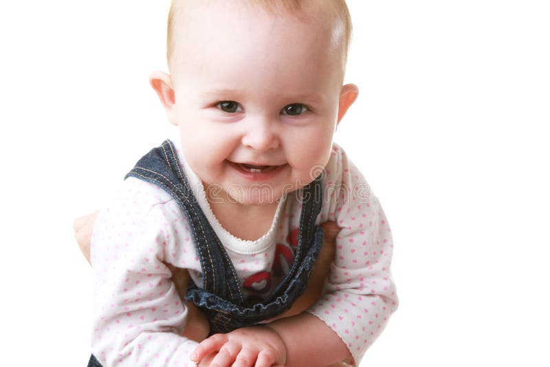 Baby Held Up and Smiling at Camera