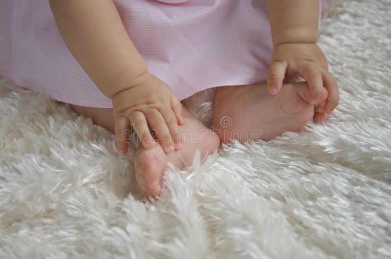 Baby Holding Feet