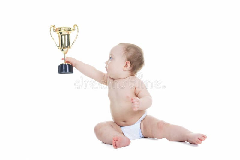 Baby holding gold trophy cup on a white background