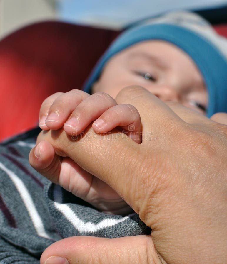 Baby holding mother finger stock images Baby holding mother finger stock images