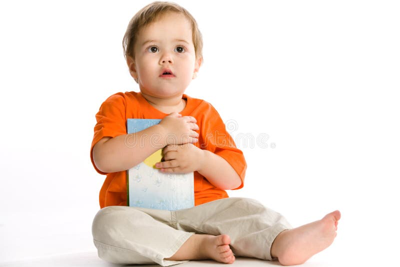 Baby holds book