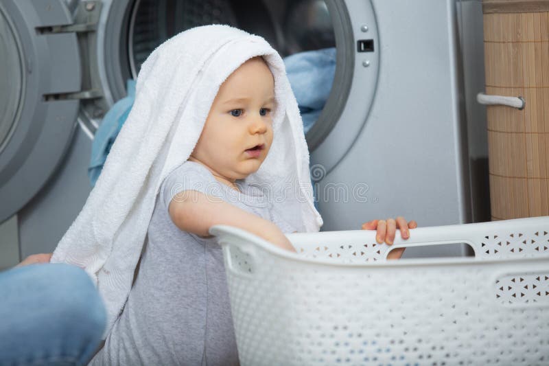 Baby in a laundry basket stock photo. Image of container 19043648