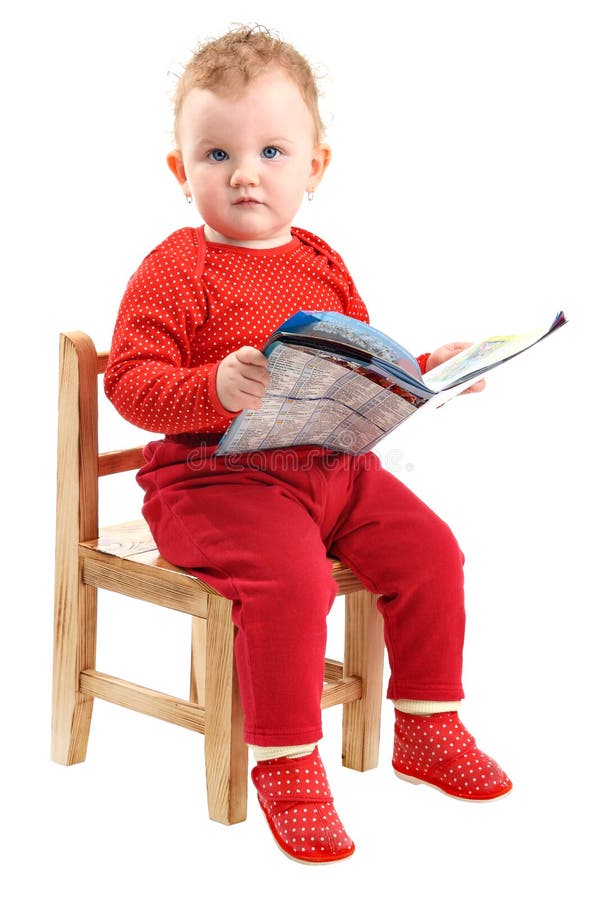 Whole body portrait of sitting baby girl dressed in red clothes, looking at camera, with some papers in her hands, isolated on white background. Whole body portrait of sitting baby girl dressed in red clothes, looking at camera, with some papers in her hands, isolated on white background