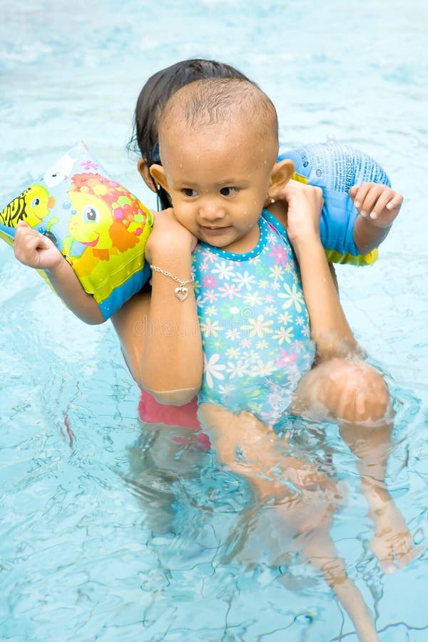 Baby learn to swim stock image. Image of learn, buoy 11571061