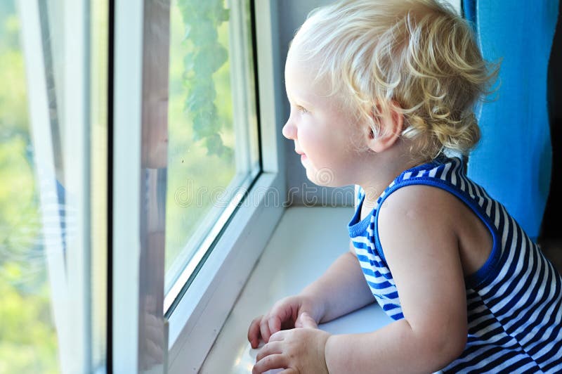 Baby looking in window stock image. Image of caucasian 33347951