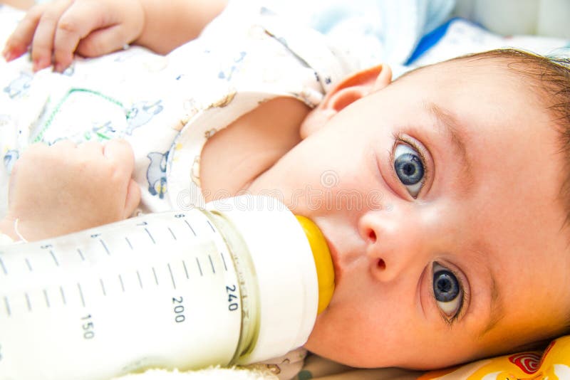 Baby and milk bottle stock image Baby and milk bottle stock image