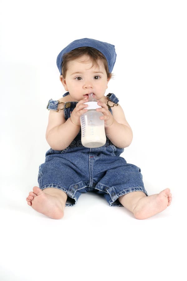Baby with a milk bottle royalty free stock photos