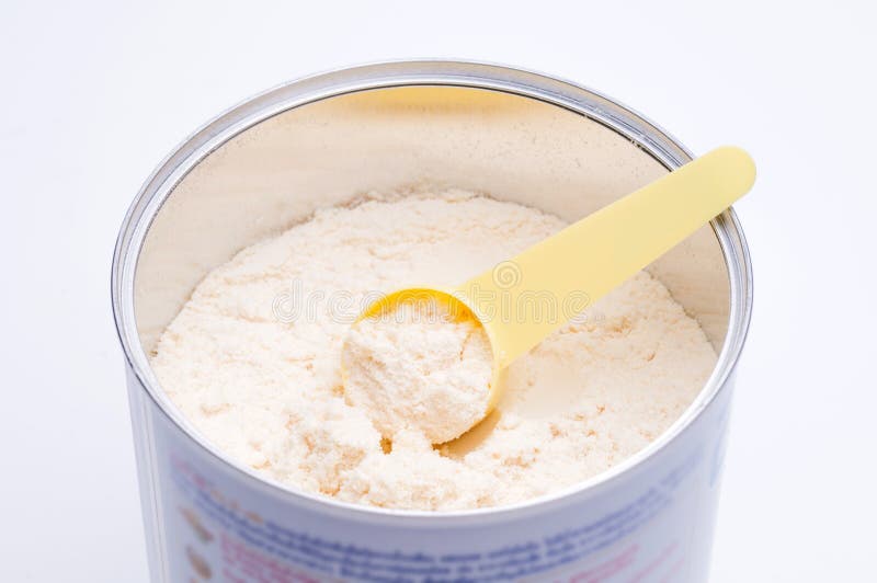 Baby milk powder in cans that open with a spoon