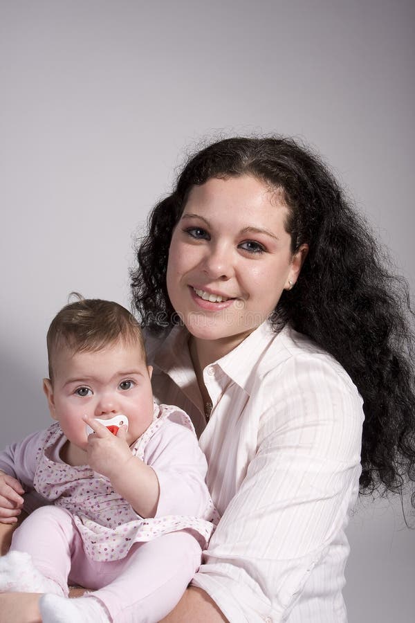 Baby and mom posing